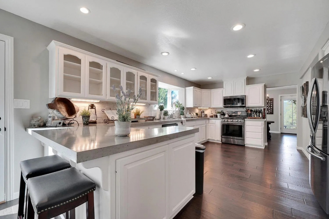 A beautiful modern white kitchen in a residential home.