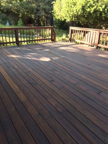 A backyard deck of a residential house.